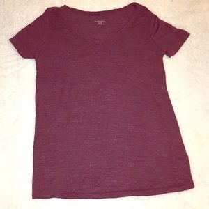 A burgundy v tee